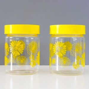 Vintage Corning Ware yellow glass storage jars with daisies